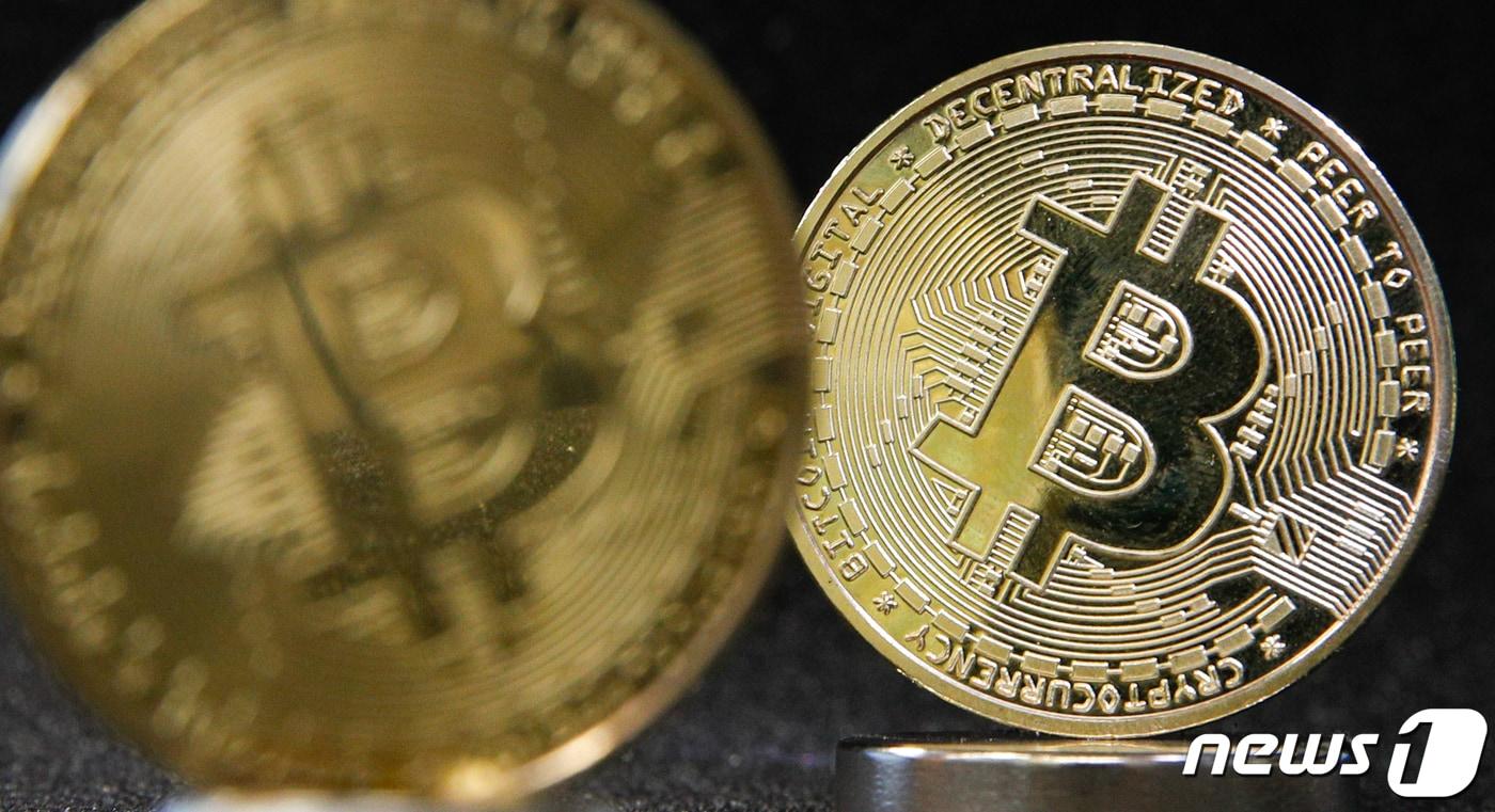 A symbolic Bitcoin coin is seen in this file photo taken Feb. 24, 2021. / Courtesy of News1