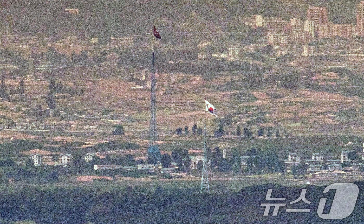 The North Korean flag and South Korean flag fly side by side in the villages of Kijong-dong and Daeseong-dong in the Demilitarized Zone &#40;DMZ&#41;, as seen from the border area in Paju, Gyeonggi Province. 2024.6.6 / News1