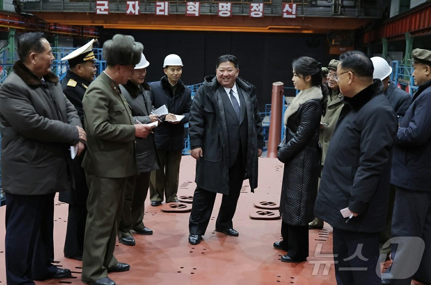 Kim Jong Un, General Secretary of North Korea's Workers' Party, and his daughter Ju-ae visiting the construction site of an 8,700-ton nuclear-powered strategic guided missile submarine on December 8 last year / Rodong Sinmun