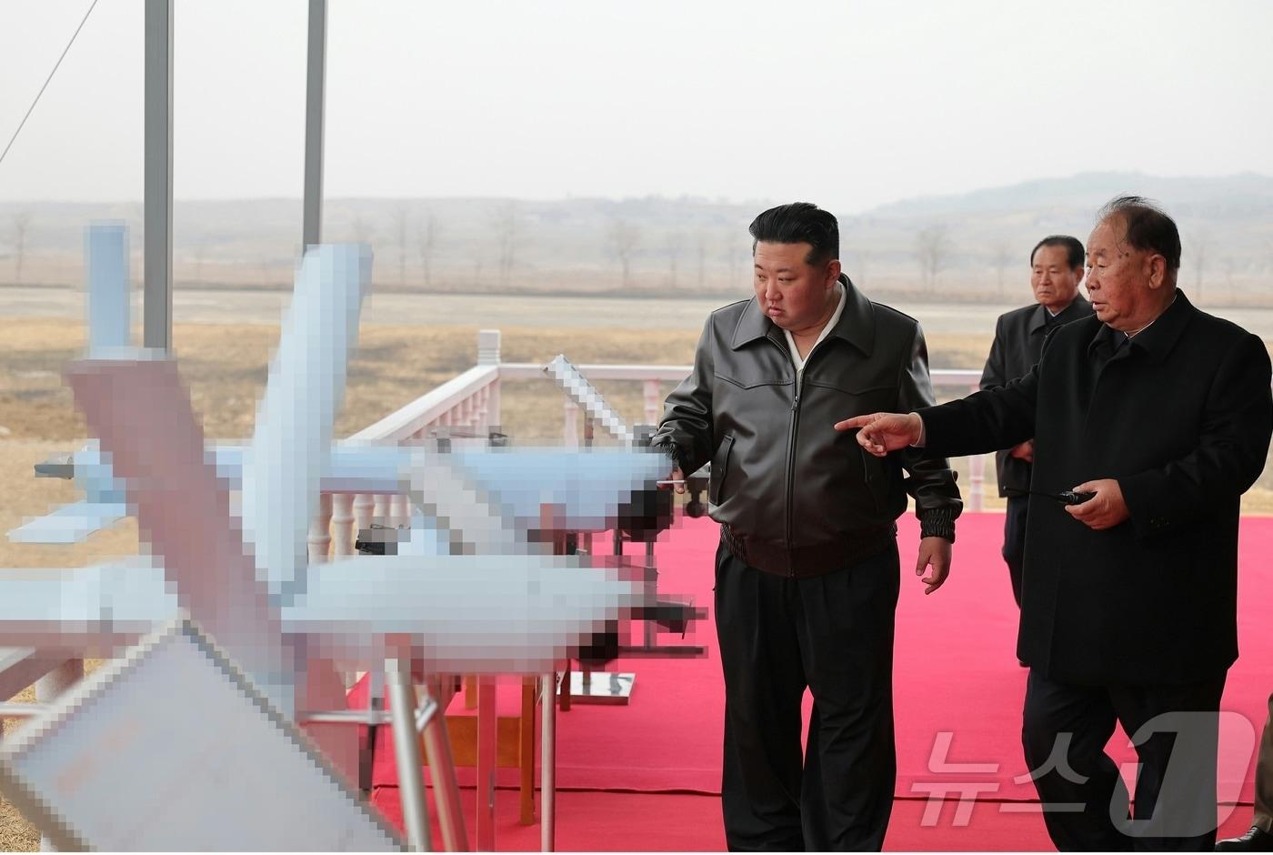 Kim Jong Un, General Secretary of the Workers&#39; Party of Korea, inspects various unmanned reconnaissance and suicide drones currently under development and production / News1