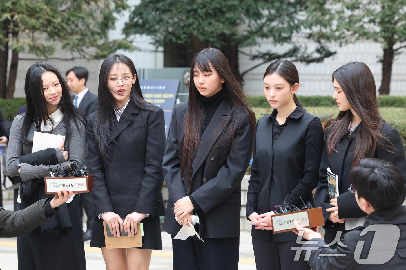 NewJeans (from left: Hanni, Minji, Hyein, Haerin, Danielle) answering reporters' questions after the first hearing for the injunction filed by ADOR against the members for 'preservation of agency status and prohibition of advertising contract signing' at the Seoul Central District Court in Seocho-gu, Seoul on March 7 last year. 2025.3.7 / News1