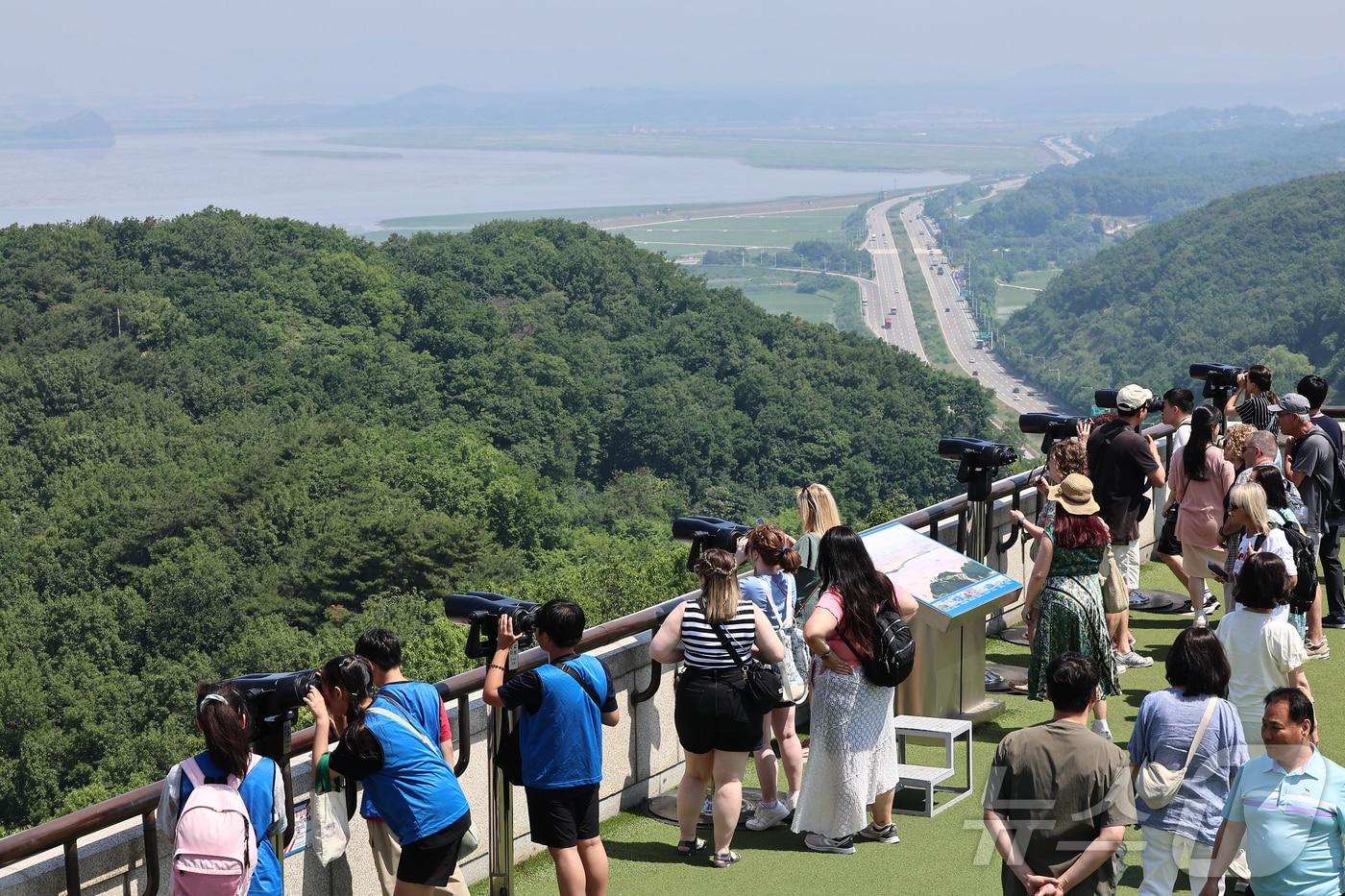 Tourists at the Odusan Observatory in Paju, Gyeonggi Province, are looking out over the area around Gaepung County in North Hwanghae Province, North Korea. 2025.6.12 / News1