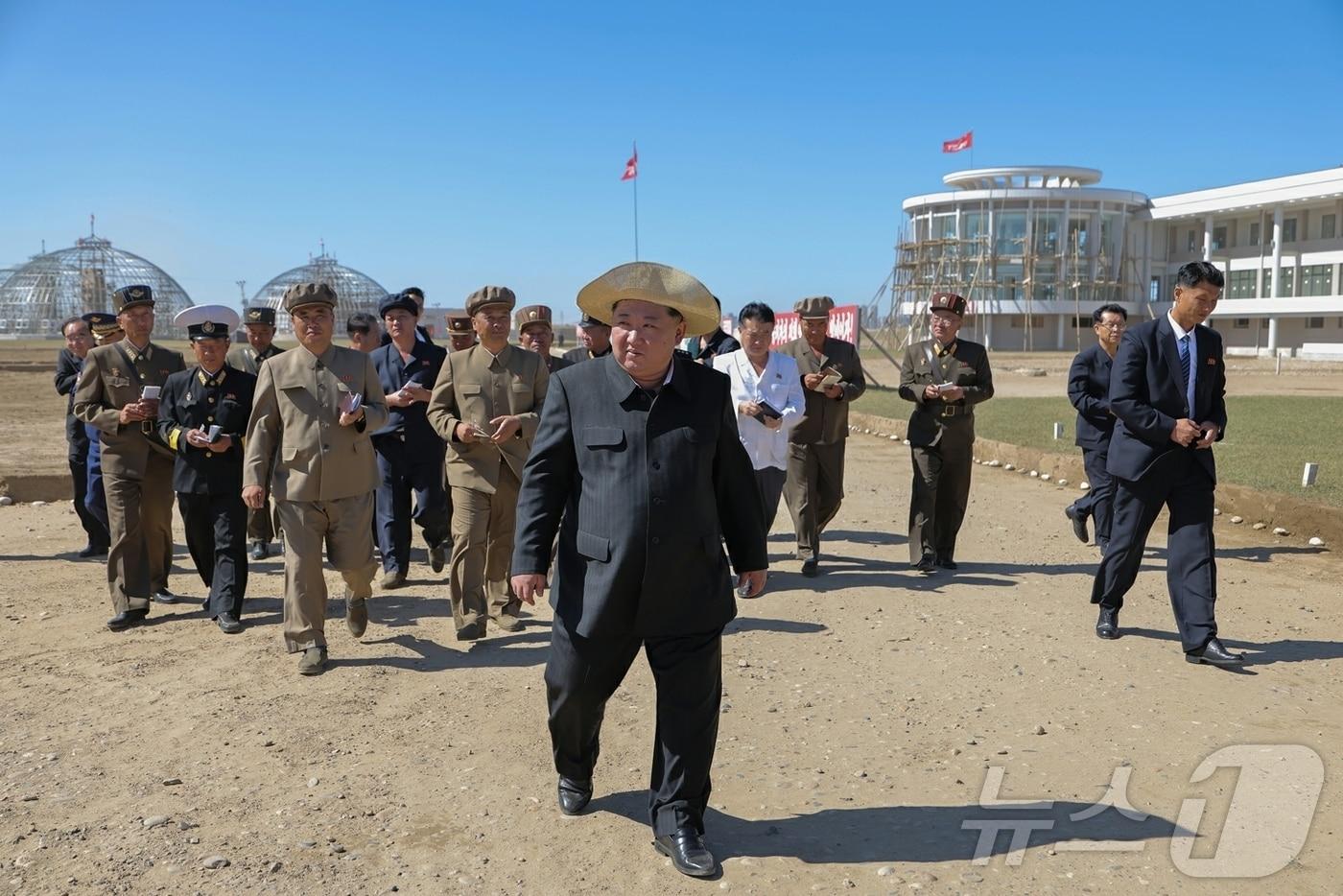 North Korea's ruling Workers' Party's newspaper Rodong Sinmun reported on Friday that General Secretary Kim guided the construction of the Sinuiju Greenhouse Complex Farm and regional development projects on-site the previous day / Rodong Sinmun
