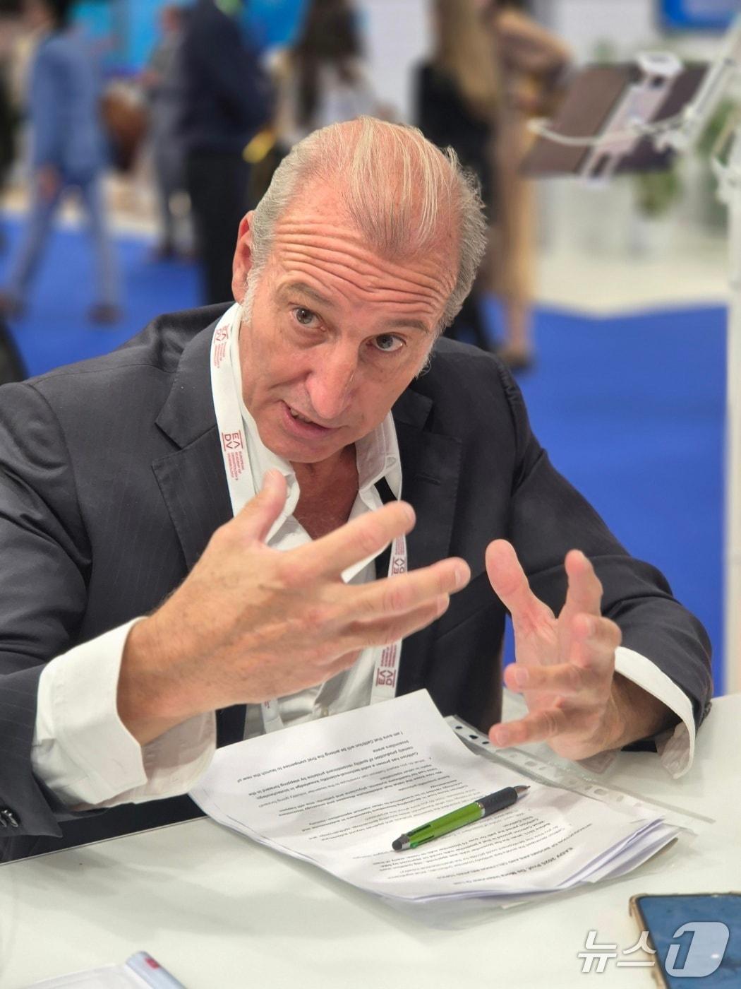 Fernando de Mora, Professor at the School of Pharmacy of the Autonomous University of Barcelona, Spain, is interviewed at Celltrion&#39;s booth at the European Association of Dermatologists &#40;EADV&#41; / News1