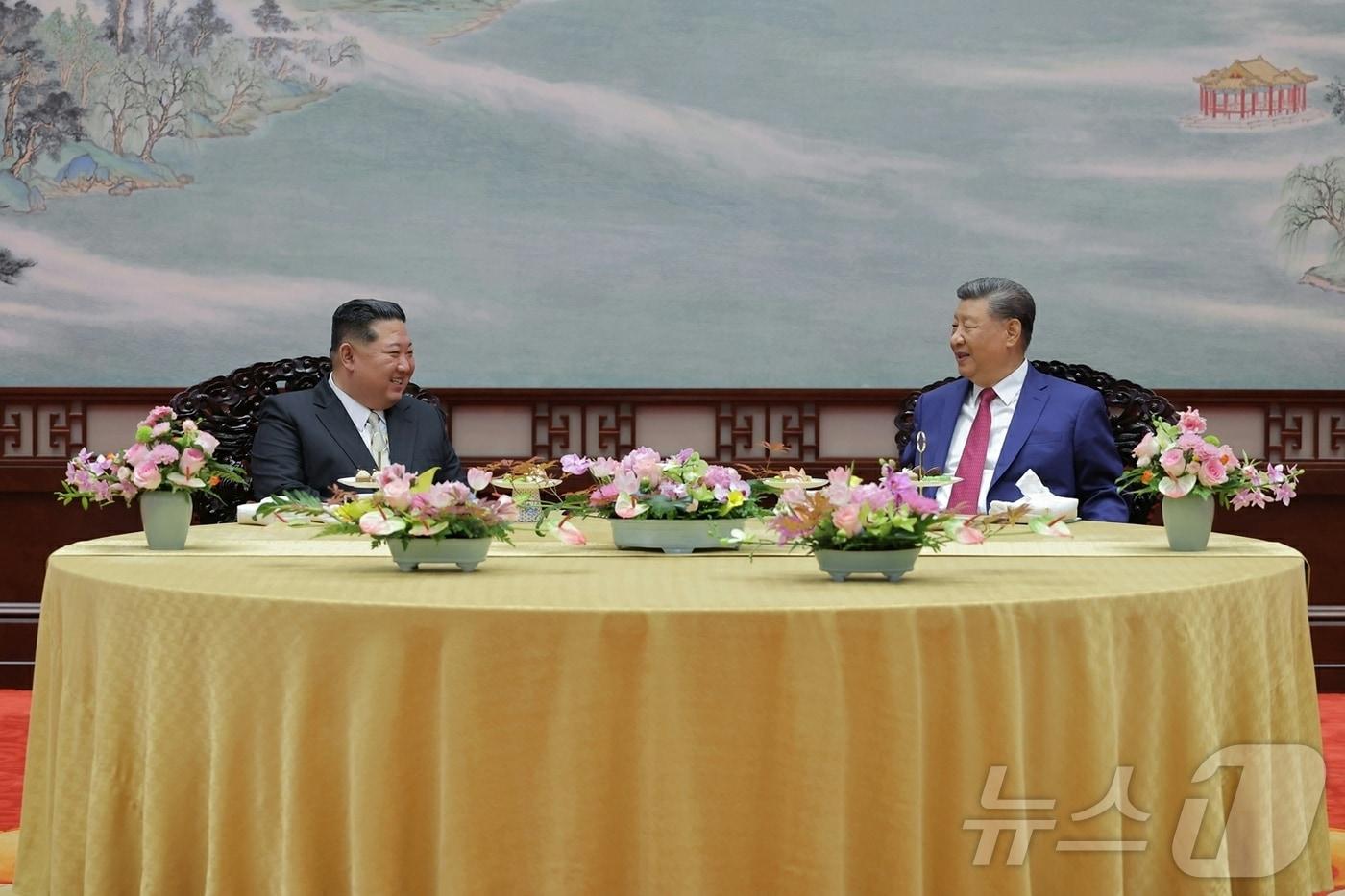The Rodong Sinmun, the official newspaper of North Korea's Workers' Party, shows General Secretary Kim Jong Un holding talks with President Xi Jinping at the Great Hall of the People in Beijing last September on the occasion of Victory Day / Rodong Sinmun
