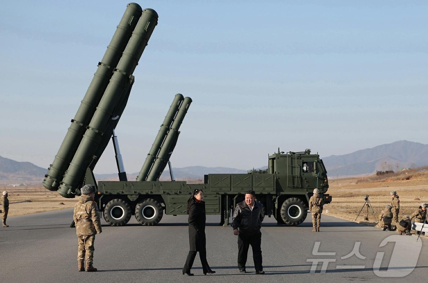 The Rodong Sinmun, the official newspaper of North Korea's Workers' Party, reported on Wednesday that Kim Jong Un, the party's general secretary, observed the test firing to verify the effectiveness of the upgraded large-caliber multiple rocket launcher system conducted by the Missile Bureau the previous day, alongside his daughter Ju Ae / Rodong Sinmun