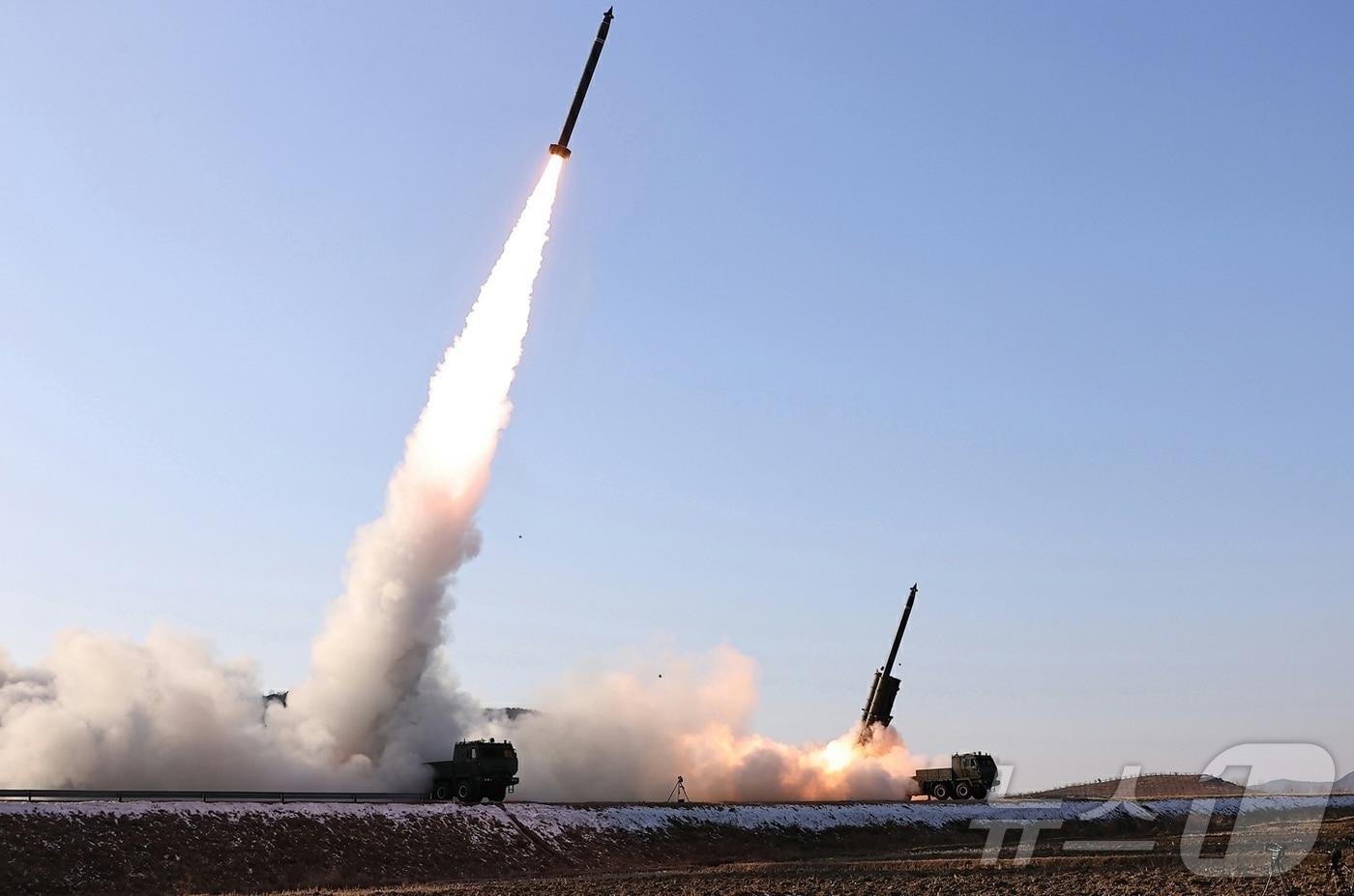A scene from the test firing to verify the effectiveness of the upgraded large-caliber multiple rocket launcher system conducted by North Korea last January / Rodong Sinmun