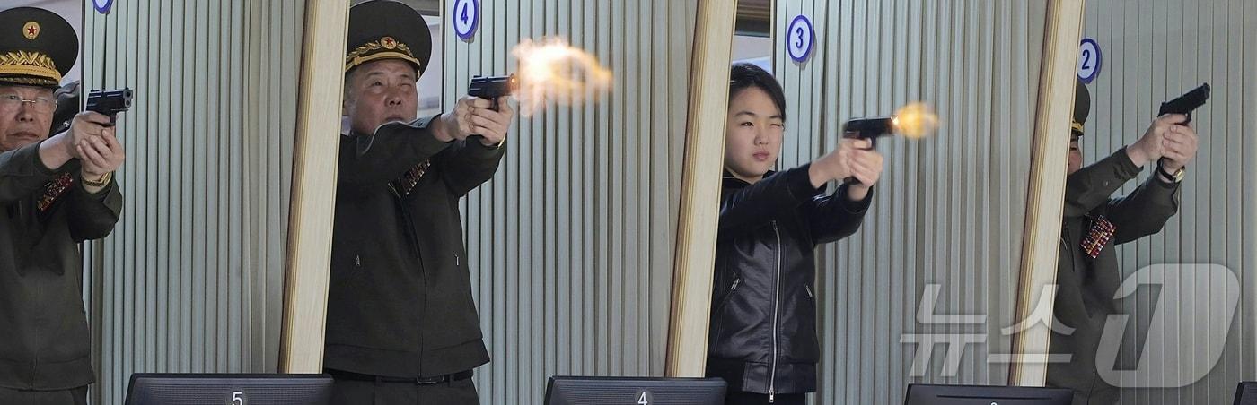 A solo photo of Ju Ae first published in Rodong Sinmun on February 28. Ju Ae is seen firing a sniper rifle alone at an outdoor shooting range / Rodong Sinmun