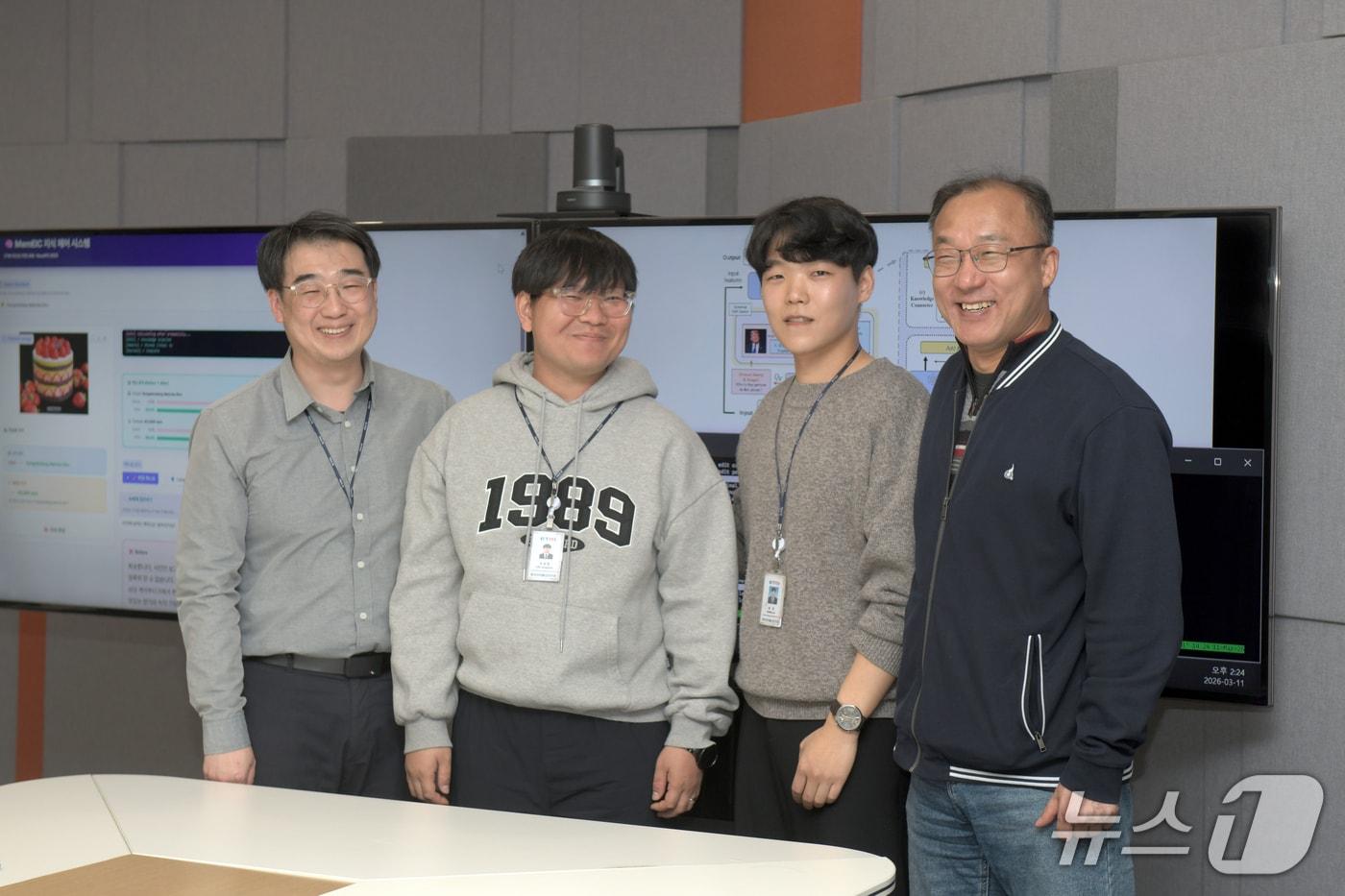 Researcher Sung Jin (third from left) and the ETRI advanced research project team who developed the Continuous and Composite Knowledge Editing technology (MemEIC). / Courtesy of ETRI