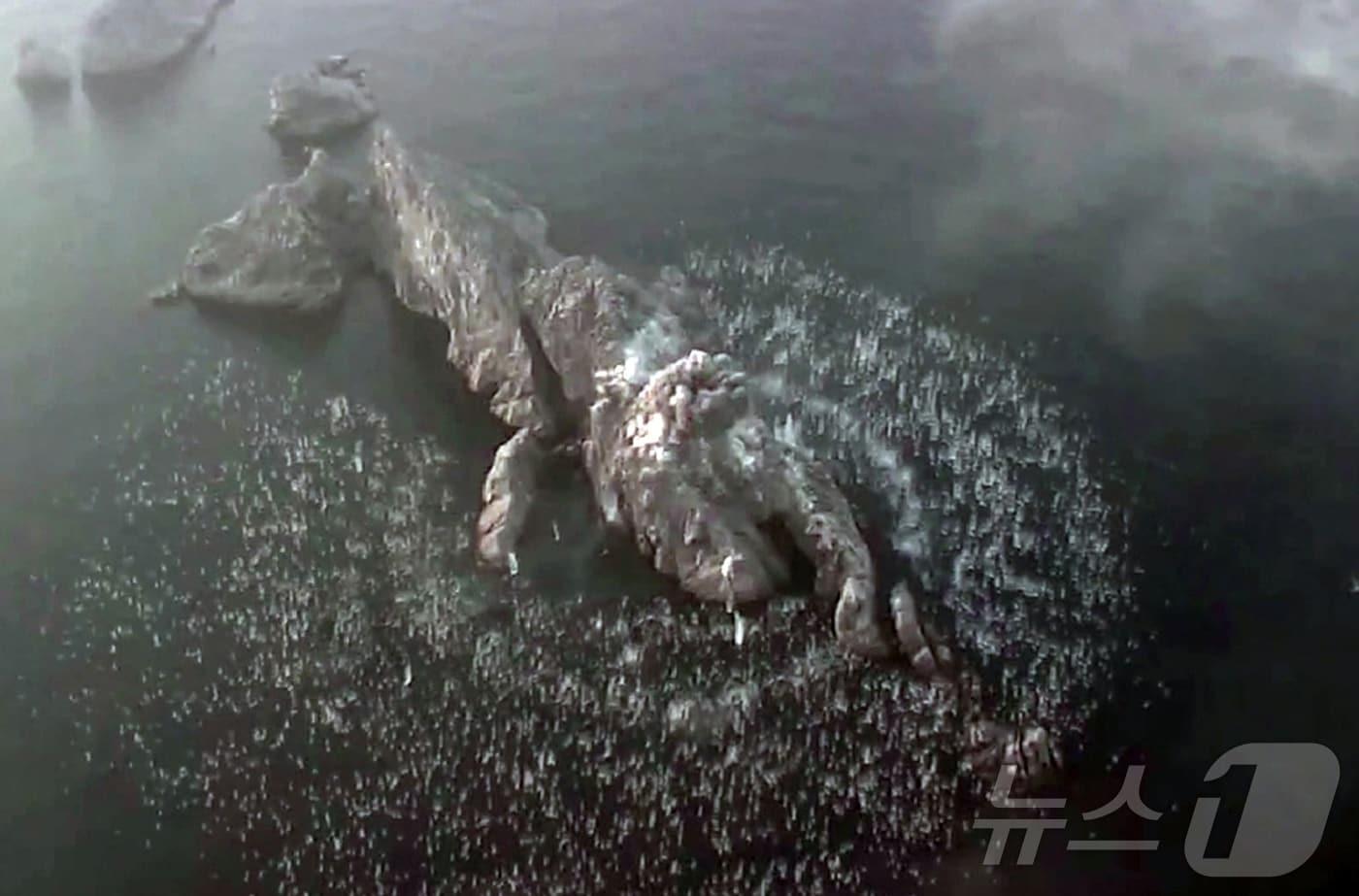 A North Korean cluster bomb exploding, with multiple small submunitions scattering in all directions and detonating / Rodong Sinmun