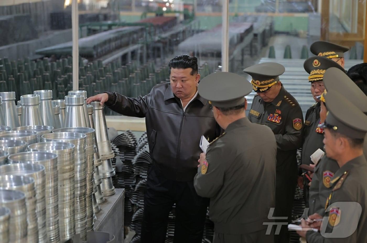 North Korean leader Kim Jong Un visits multiple defense industry facilities on May 11, according to the ruling Workers’ Party newspaper Rodong Sinmun on May 13. Kim toured factories producing mortar and artillery shells as well as ammunition alongside military officials. / Courtesy of News1