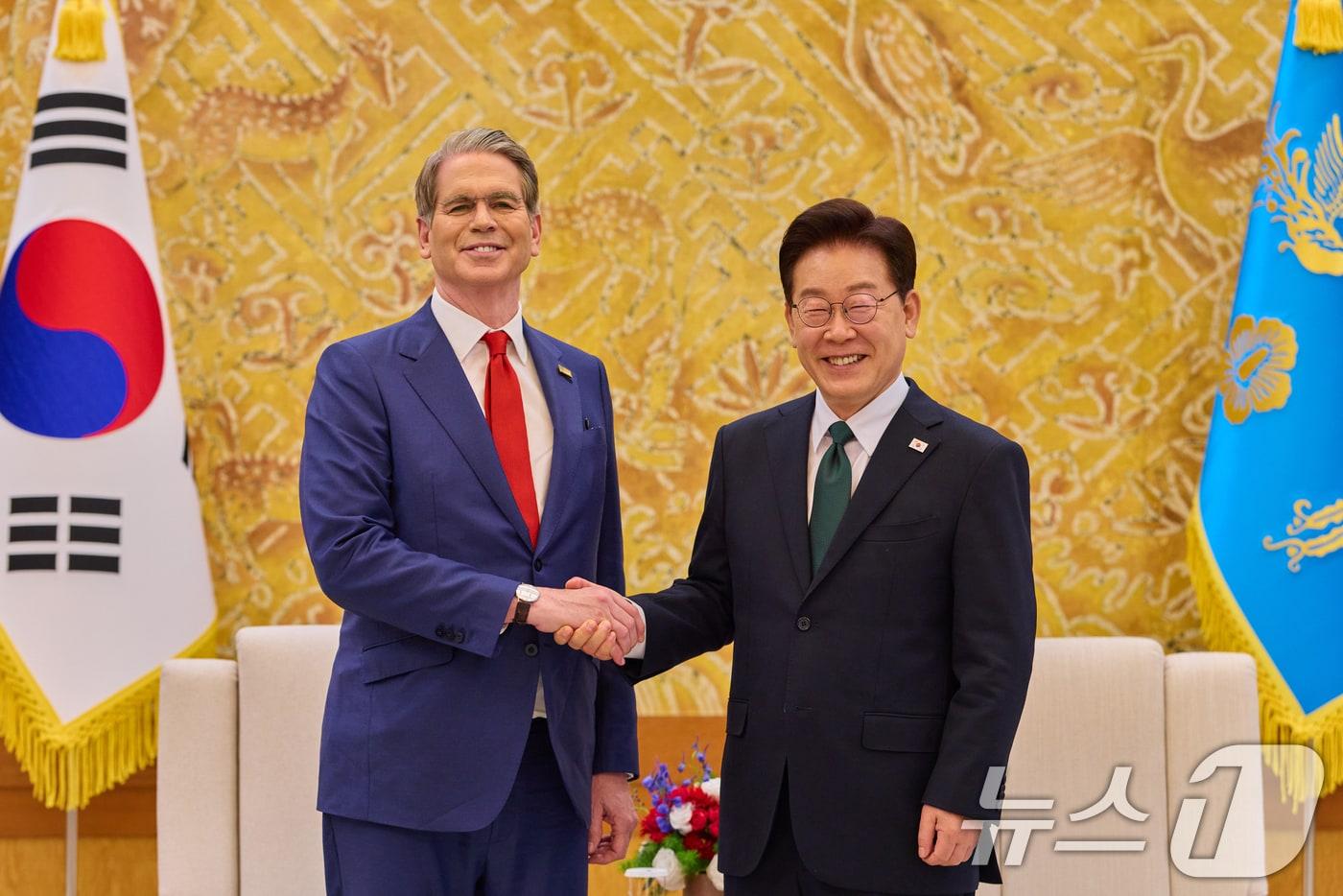 South Korean President Lee Jae Myung shakes hands with U.S. Treasury Secretary Scott Bessent at the presidential office in Seoul on May 13. (Provided by the presidential office. Resale and DB prohibited) May 13, 2026. / Courtesy of News1