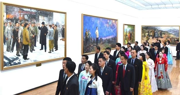 "Brainwashing Level: MAX" Inside the Kim Jong Un's Twisted Fantasy Land of Propaganda Art